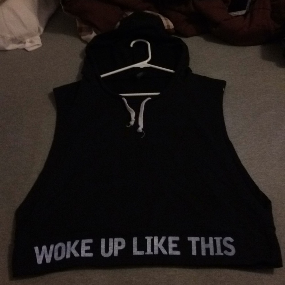 A sleeveless hoodie. Black and has a pocket.